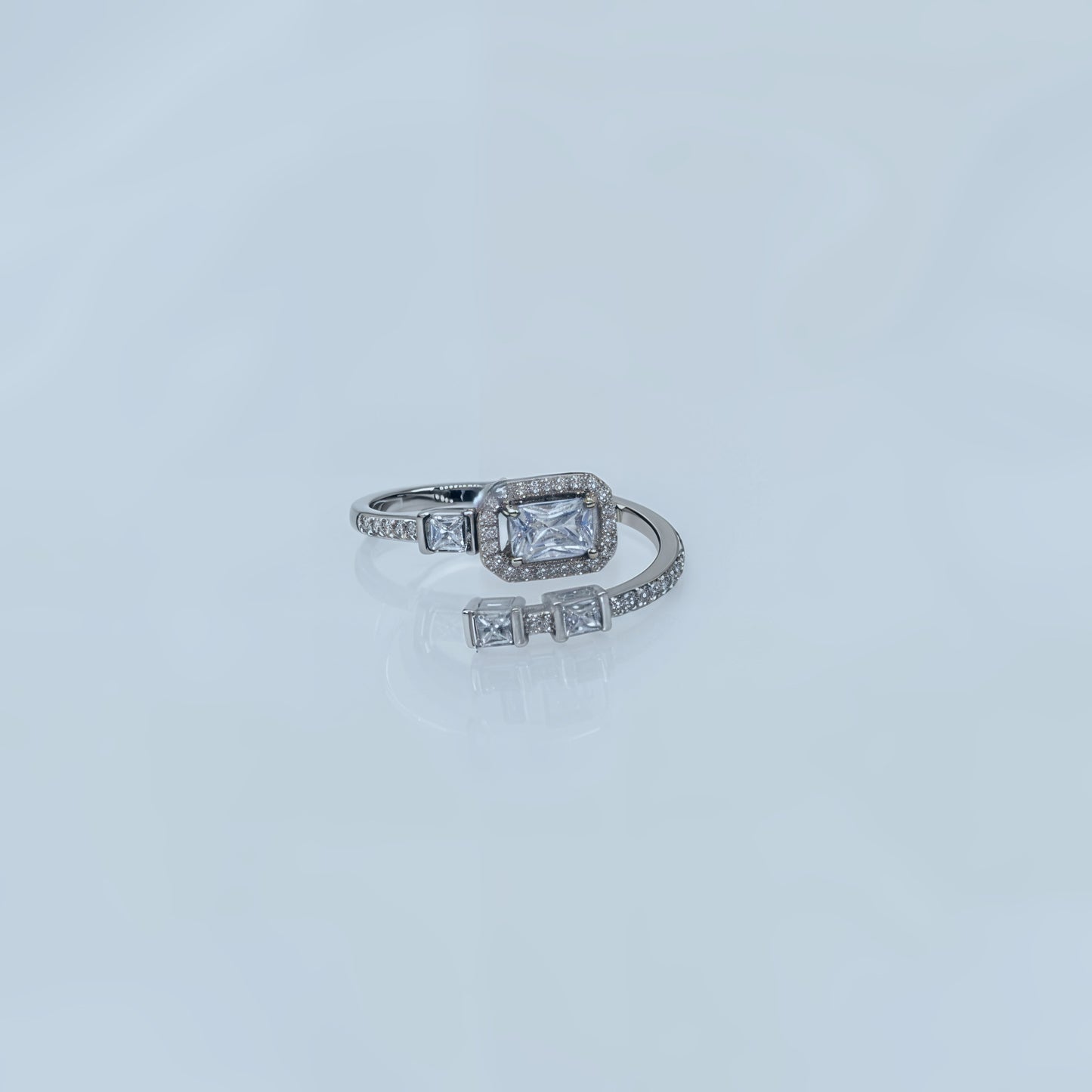 “Regal Emerald-Cut Halo Adjustable Ring – Italian 92.5 Silver Elegance”