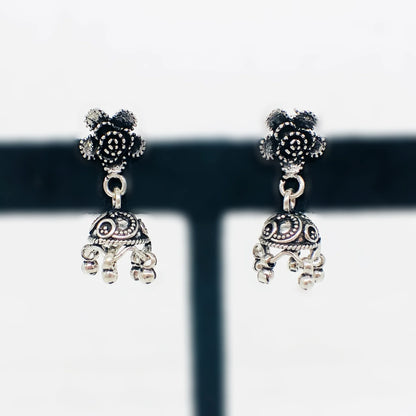 Silver antique jhumka earrings with floral stud and intricate dome design